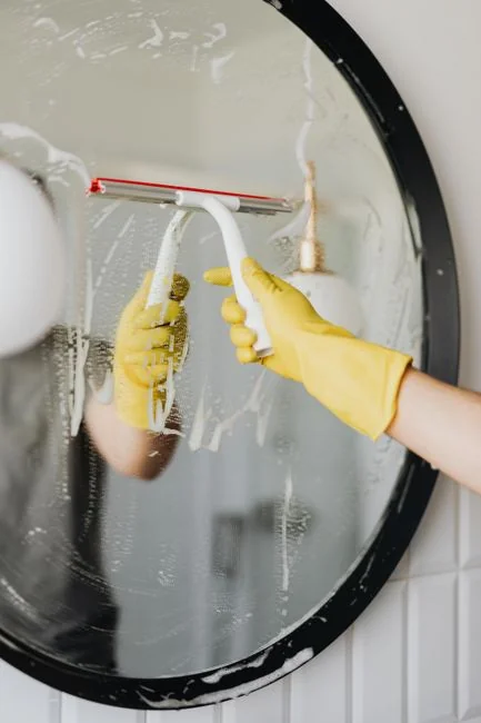 A cleaner washing the floor in a laboratory setting